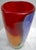 This hand-blown art glass vase, measuring 12 inches tall by 6 inches in diameter, is a heavy-duty centerpiece offering an...