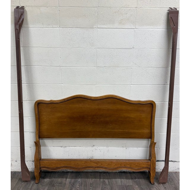 This is a beautiful vintage French Provincial full sized bed crafted in solid oak with a warm medium oak finish. Believed...