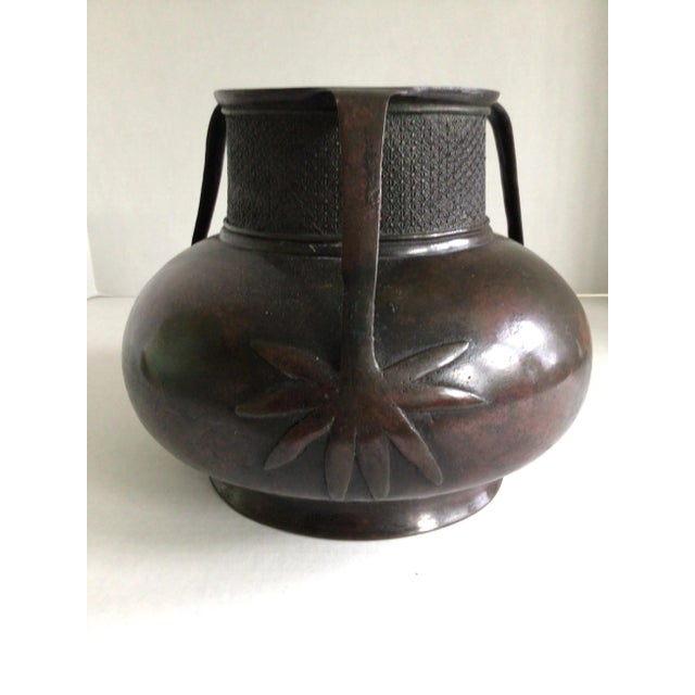 1880s Bronze Japanese Vessel with 3 Handles Handles terminate into palm fronds Patterned Rim Small dent as shown in pictures