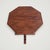 The Gothic Revival Mahogany Accent Table is built in solid mahogany: an octagonal top with a dentil-carved frieze, set on...
