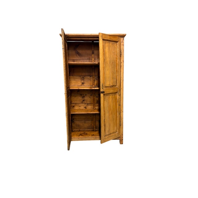 A simple poplar cabinet dating back to the early 1900s. Featuring simple, functional lines, it retains a pleasant patina...