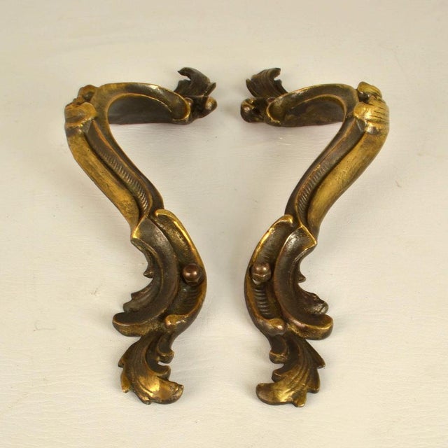 Two double Italian Baroque style push and pull bronze door handles with elaborate design and original patina. They are...