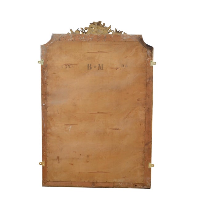 Very attractive gilded mirror, having original bevelled edge glass with some foxing in beautifully carved frame with...