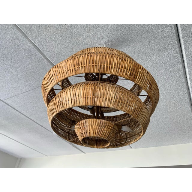 The Woven Chandelier is an impeccable marriage of artistry and high-quality construction. Natural rattan forms the body of...