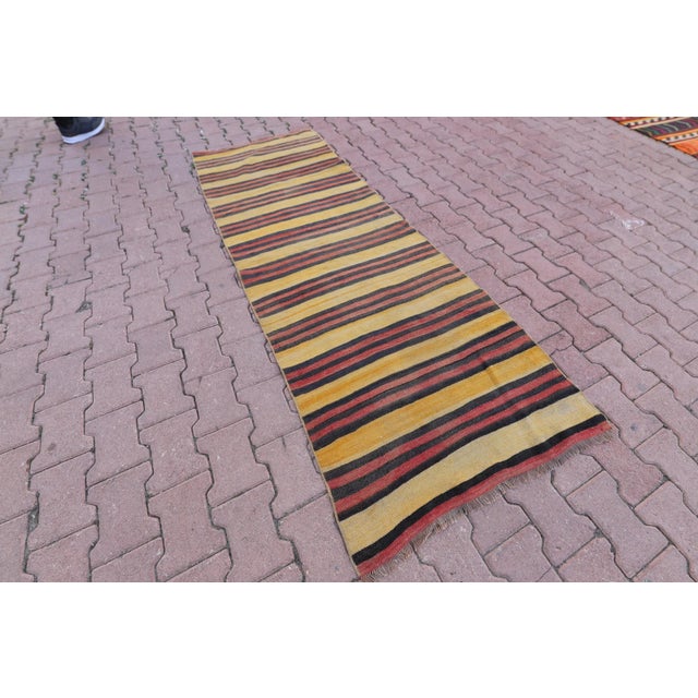 1960s Southwestern Striped Hand Knotted Nomadic Kilim Runner Rug Size: 2.9 x 7.7 ft ( 87 x 231 cm) 34 x 91 inches Color:...