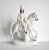 An antique, 19th-century Staffordshire ceramic figurine or statuette of a Scottish rider or hunter on a white horse, with...