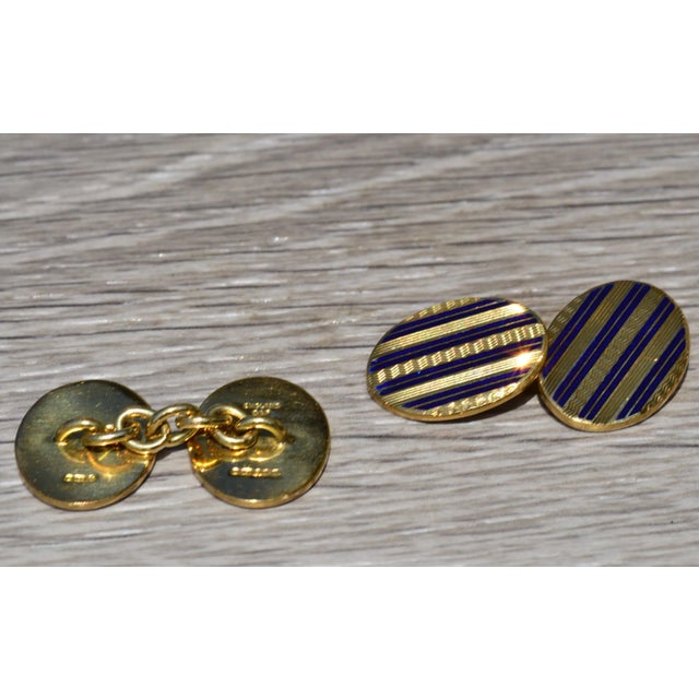 The Deakin: Deakin and Francis Signed Enamel Cufflinks in Yellow Gold. The cufflinks feature a royal blue enamel among...