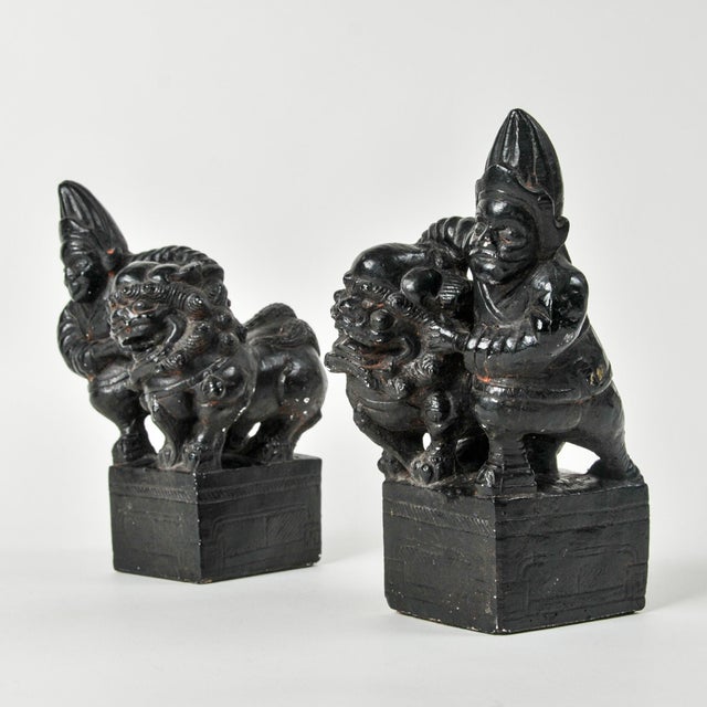 Very unique and mysterious bookend pair featuring Chinese or Japanese mythological figures. Each is slightly different, it...