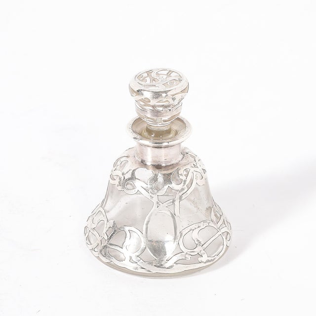 This exquisite Art Nouveau perfume bottle, crafted in America circa 1910 and signed by Steuben, is a true testament to the...
