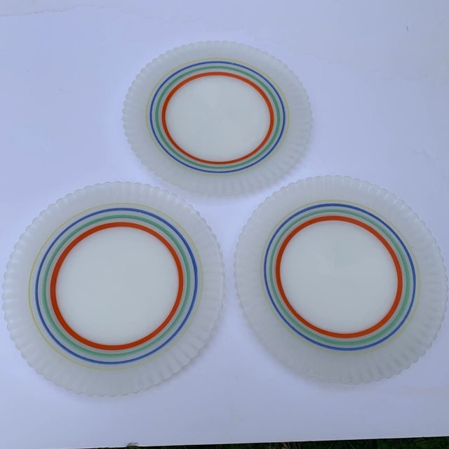 A remarkably rare and unusual 3-piece plate set of primary rainbow colored hues, not at all muted in coloration,...