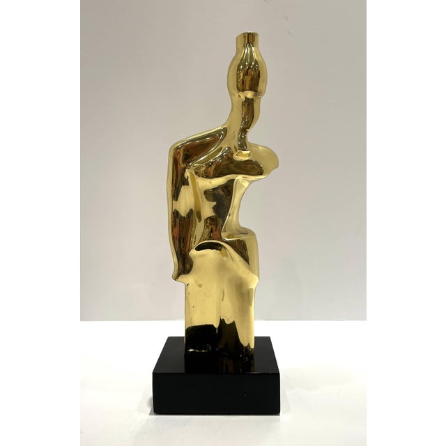 Polished Bronzed Figural Sculpture on Black Acrylic Base.