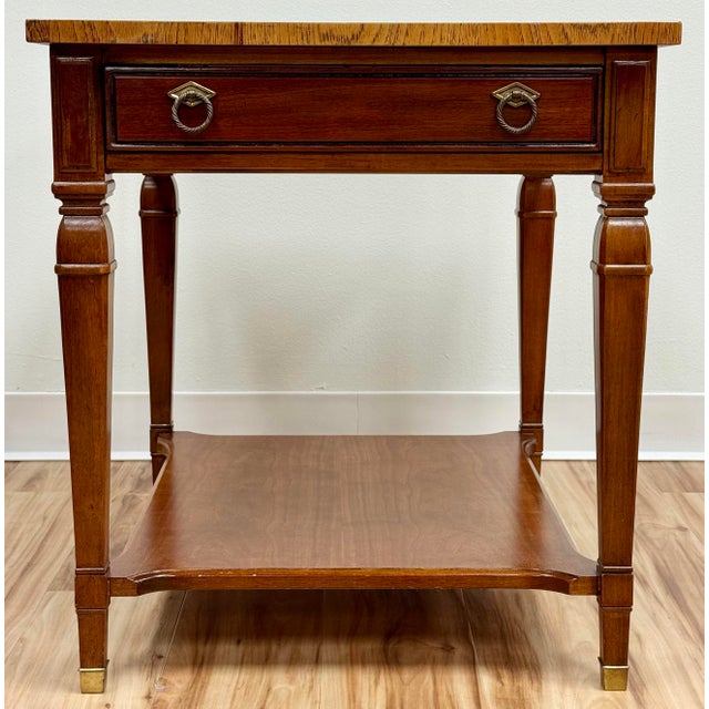 Vintage rich wood side table with brass capped carved wood legs from Drexel Furniture. Ample size. Table has one drawer...