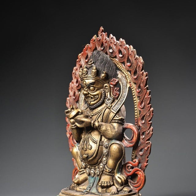 This is a finely crafted antique gilt bronze sculpture of Mahakala, a fierce and powerful protector deity in Tibetan...