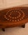 French - 1960s Brutalist coffee table made from a mahogany trunk inlaid with circular decorations in light wood. Two...