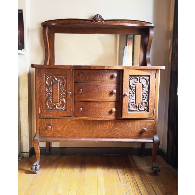 Antique American sideboard or buffet dating to the late 19th or early 20th century, attributed to the Victorian era with...