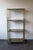 A stylish vintage shelf, perfect as a display piece in a living room or shop. It features a gold-tone metal frame and...