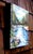 This artwork captures the serene flow of the Wenatchee River, surrounded by lush greenery and distant mountains. The...