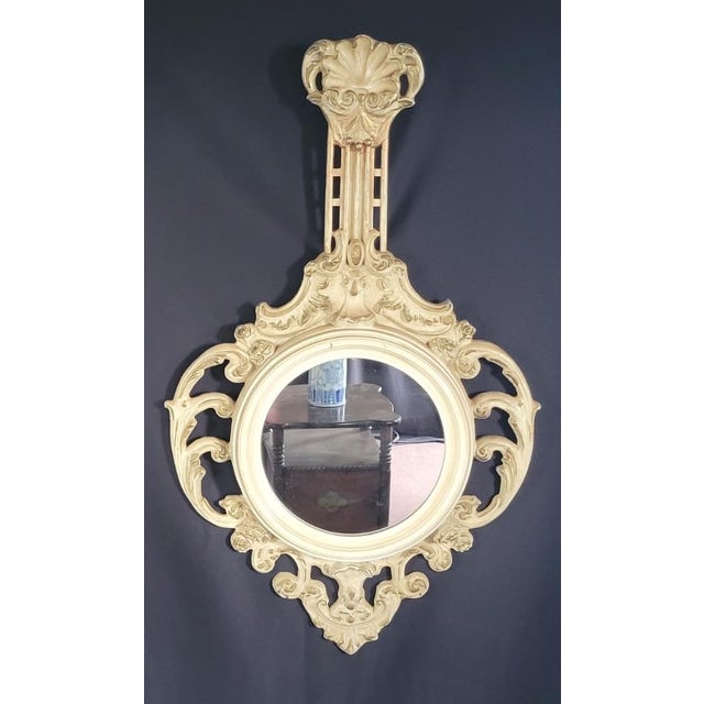 Elegant c.1960 Italian Art Nouveau style round wall mirror, hand carved, hand painted, and gilt decorated. A beautifully...