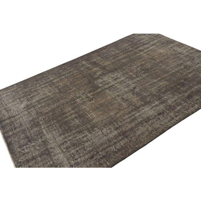 This vintage 5x8 rug, hand-knotted in wool, circa 1960-1970, is one of Zeki Müren’s rare pieces in ‘solid’ silver/gray...