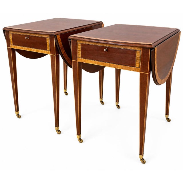 Elegant pair of mahogany drop-leaf side tables featuring beautifully contrasting satinwood-style inlay, single drawers,...
