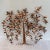 A vintage “Tree Of Life” wall sculpture by Curtis Jere. The mid century wall sculpture features a copper and brass tree...