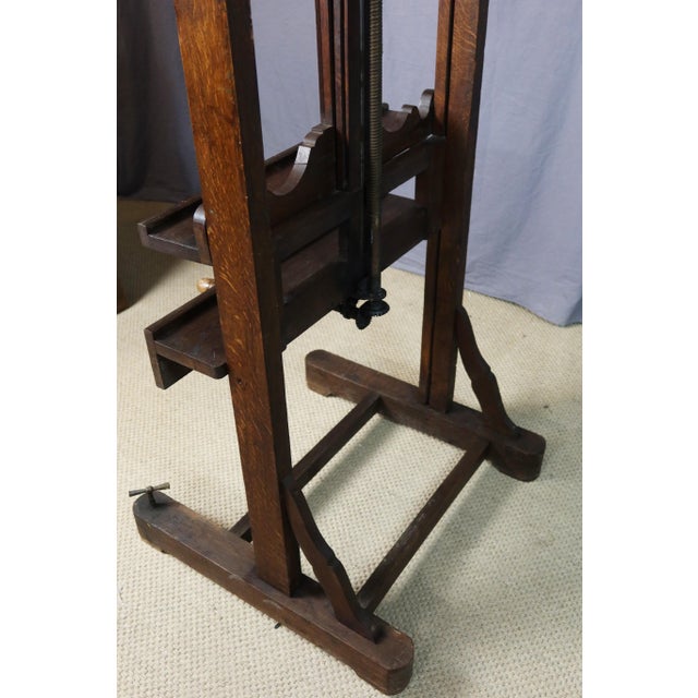 Large 19th-century oak painter's easel. It features a double rack and pinion mechanism (one for raising and lowering, and...