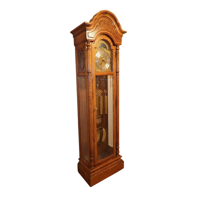 1990s Howard Miller Oak Grandfather Clock With Kieninger Triple Chime Movement and Moon Dial For Sale