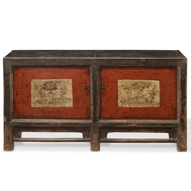 This antique sideboard from Gansu, circa 1890, features traditional black, red, and cream colors and was originally used...