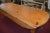 This is a huge & very heavy/thick pine dining table. Someone said it is possibly an Irish wake table. It has wooden rods...