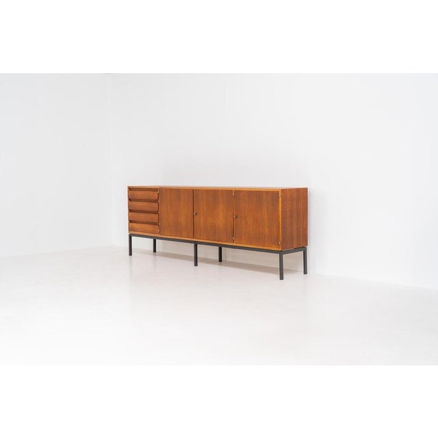 XL Modernist sideboard by Behr Möbel (Germany, 1950s). This striking modernist sideboard was produced in the 1950s by the...