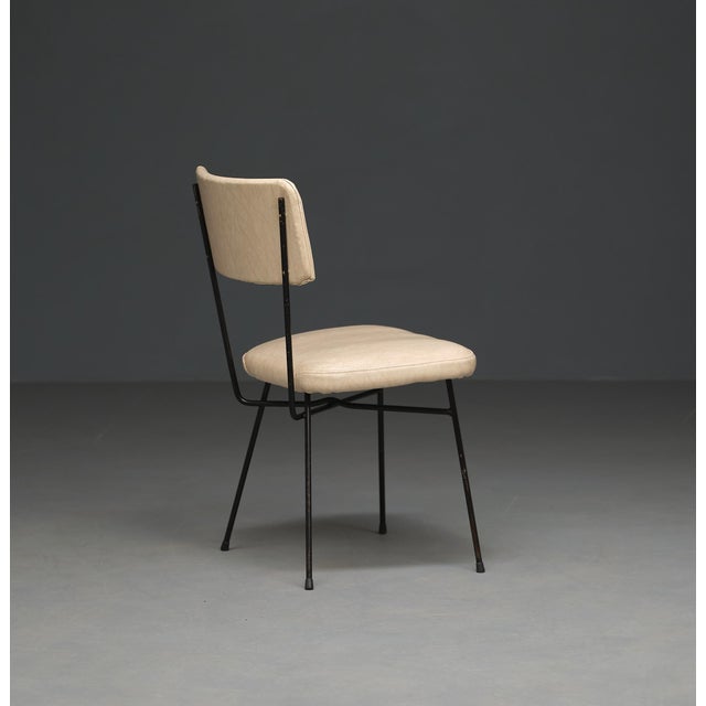 These chair feature a robust black-painted iron rod frame, exuding an aura of sophistication and enduring quality. The...