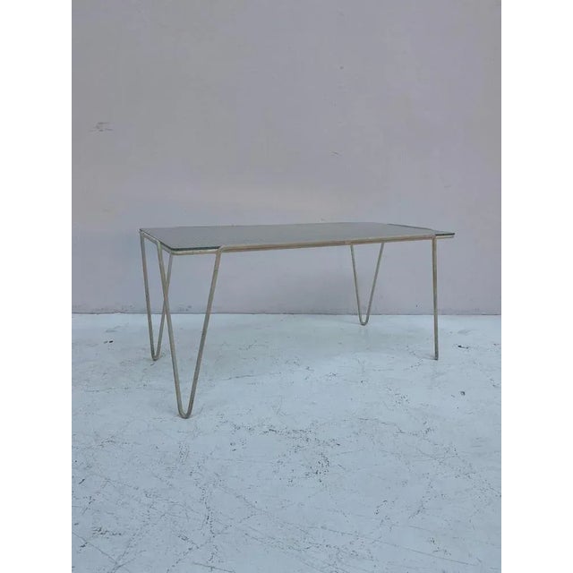 Classic Dutch post-war design, minimalist table in white metal with the original safety glass top. Designed by Arnold...