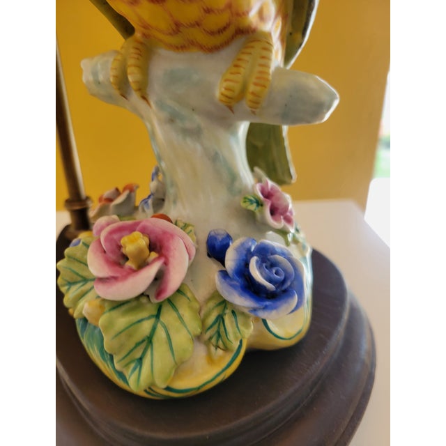 A custom made fine porcelain cockatoo figurine with exceptional color and detail has been museum mounted on a rosewood...