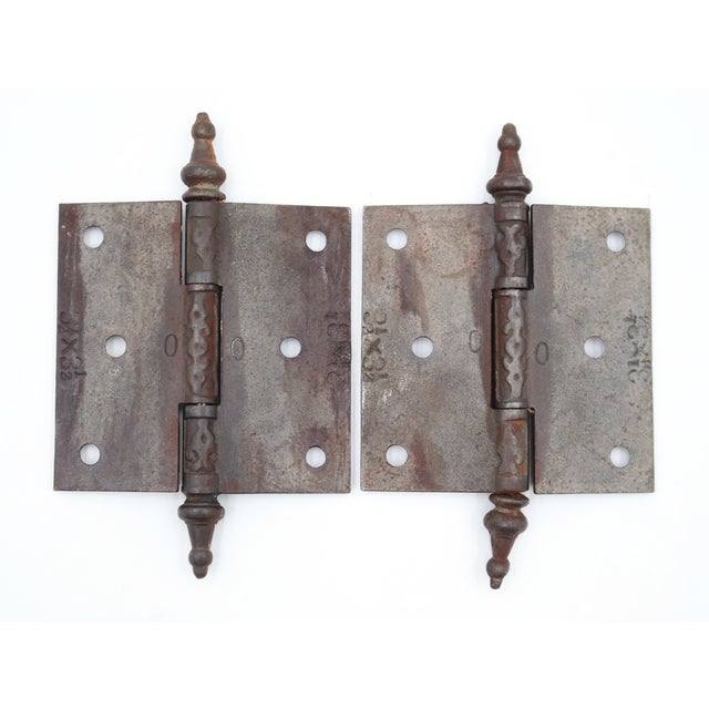Victorian style door hinges made of cast iron with steeple tips, three knuckles, and a template hole pattern. The original...
