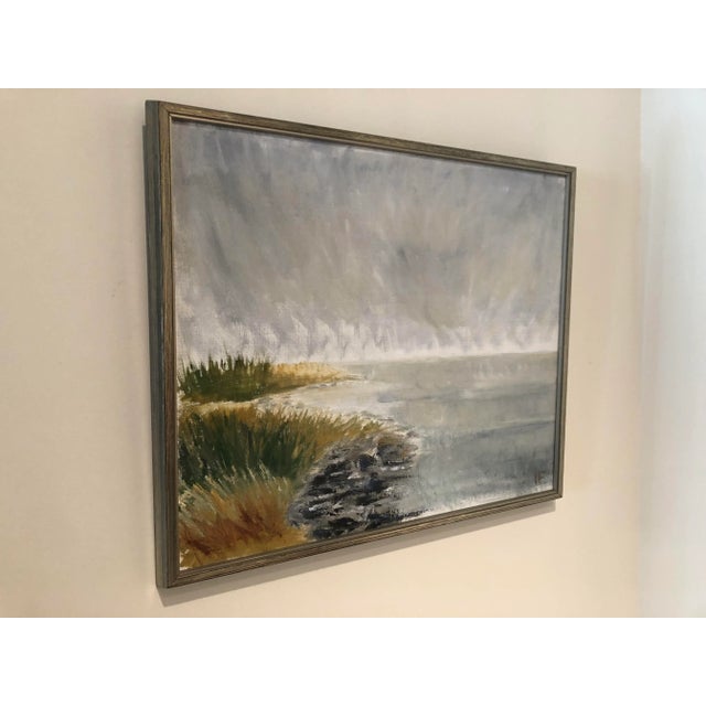 Vintage Swedish coastal painting. Light and airy colors depicting part of a beach. Silver wood frame. Measures 19”x23”...