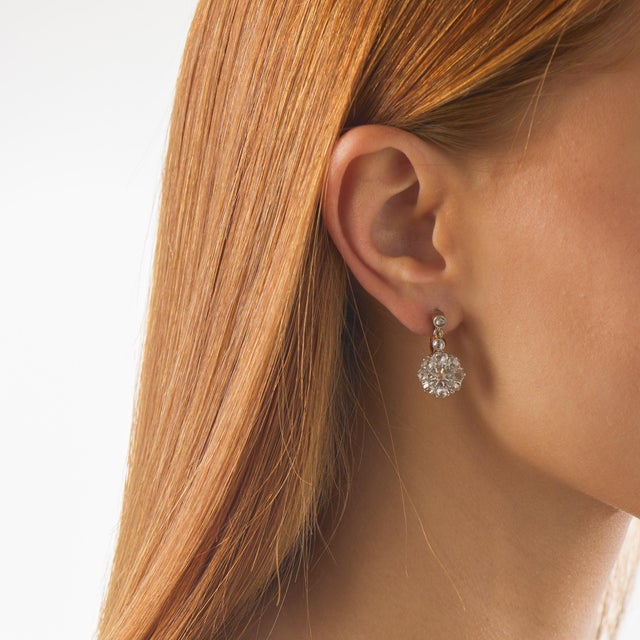 These authentic Victorian cluster earrings showcase 22 rose cut diamonds totaling approximately 1.45 carats, arranged in a...