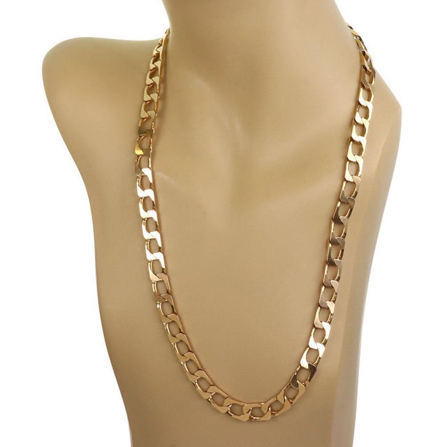 This technigold long Cuban link chain is crafted from 14k yellow gold, it is 9mm wide and has long flat rectangular links....