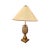 Table lamp made of gilded bronze, in Hollywood Regency style. Decorated with a finely crafted central gilded bronze...