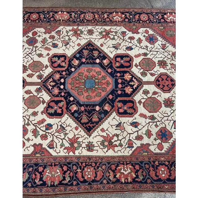An extraordinary and highly collectible piece, this antique Malayer rug stands out for its refined composition, luminous...