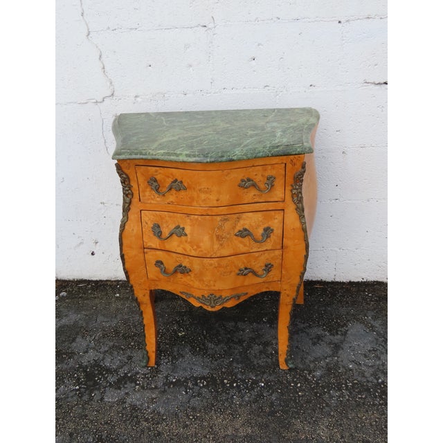 This classic Nightstand is made out of wood, solid wood, burlwood, veneer, metal, and marble. This Commode was made in the...