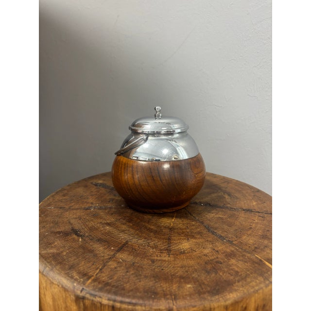 A delightful vintage English tea caddy, combining both charm and utility. The base vessel is crafted from oak, its warm...