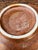 Exuding artisan craftsmanship and organic mid-century design, this vintage ceramic bowl features a warm, earthy studio...