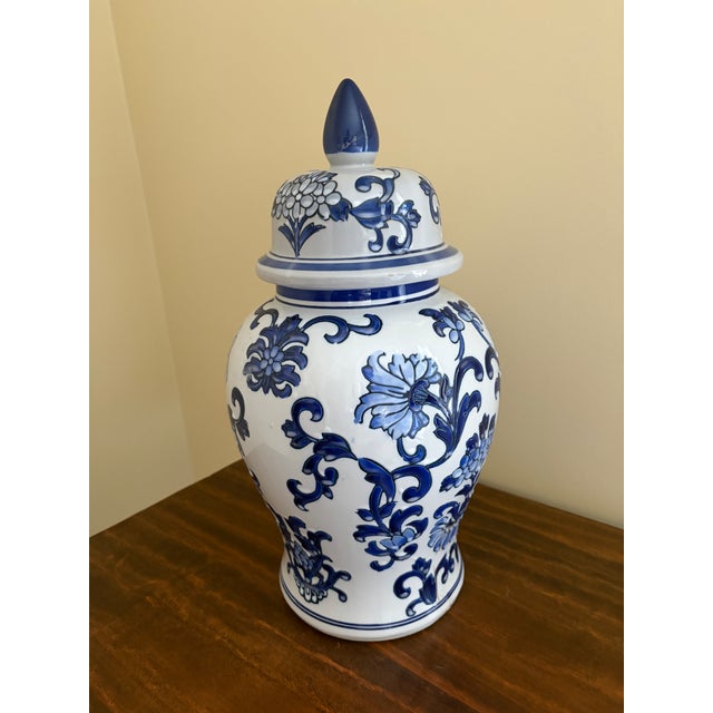 A beautiful large Chinoiserie blue and white porcelain covered ginger jar or temple jar China, Late 20th Century Measures:...