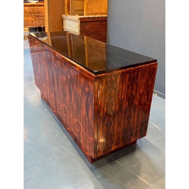 This early 20th century Rosewood and black lacquer side cabinet exudes an Art Deco style, making it a striking piece of...