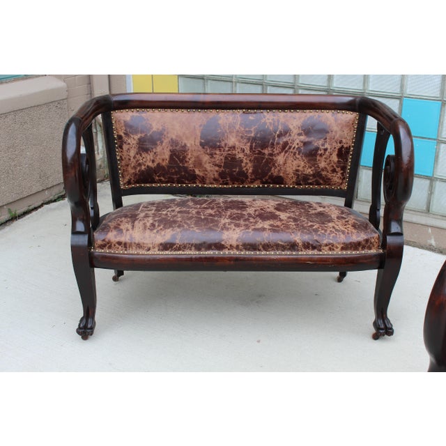 Experience Classic Opulence with an Empire Mahogany Rolled Arm Settee with Claw Feet Indulge in the timeless allure of the...