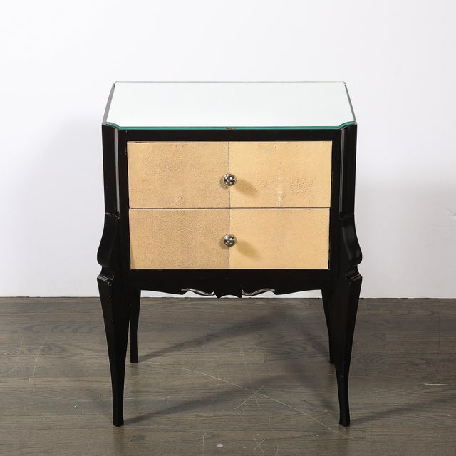 These exquisite Art Deco Directoire-style ebonized nightstands, crafted in France circa 1940, exemplify the sophisticated...
