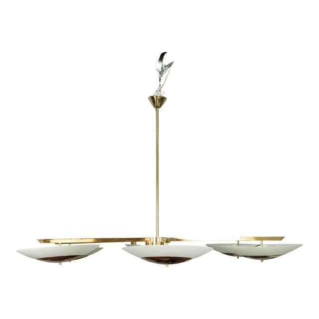 Monumental (73 Inch) Italian Brass And Glass Chandelier Attributed To Stilnovo. This huge Italian Modernist chandelier...