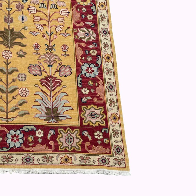 Beautiful large-scale handwoven Soumak rug featuring an intricate garden-inspired botanical design on a warm golden-yellow...