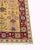 Beautiful large-scale handwoven Soumak rug featuring an intricate garden-inspired botanical design on a warm golden-yellow...