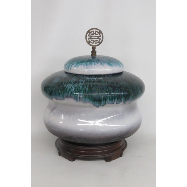 This gorgeous Large Lidded Jar is made out of ceramic. This vibrant jar presents a tapered and rounded silhouette, and was...